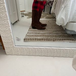 Brown cowhide leather boots.